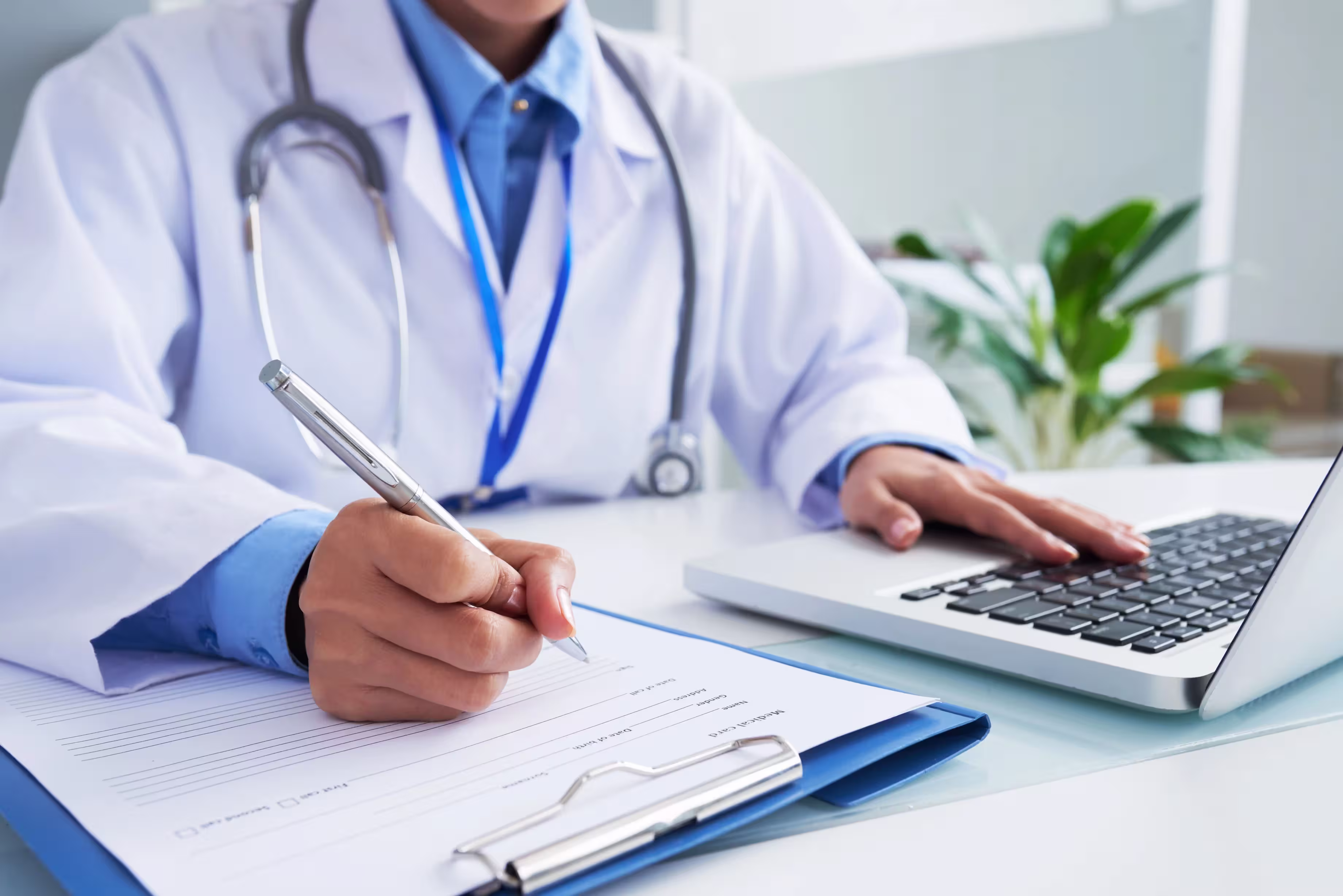 Doctor reviewing electronic health records and security compliance protocols