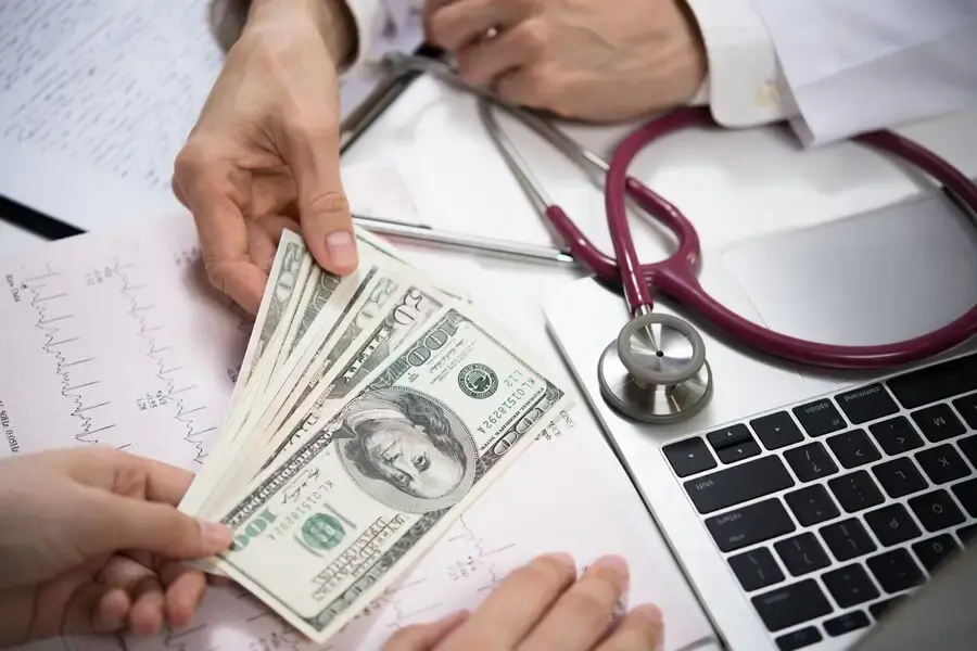 doctor receiving fees